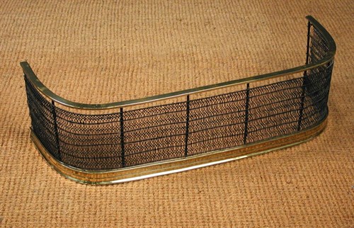 Lot 874 - A Regency brass and wire fender