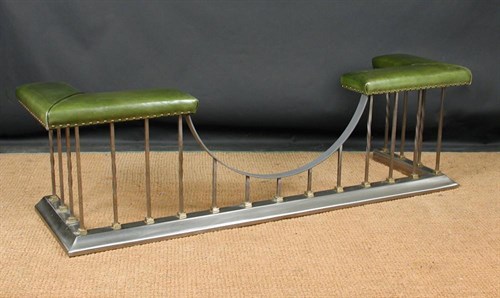 Lot 873 - A polished steel club fender, 20th century